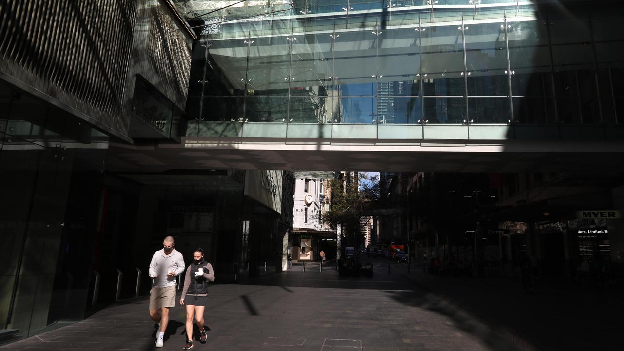 People walk down an empty Pitt Street mall in Sydney’s CBD. Picture: Damian Shaw