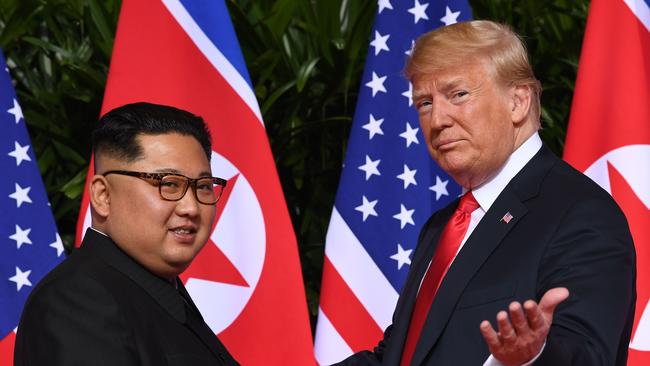 US President Donald Trump gestures as he meets with North Korea's leader Kim Jong-un at the start of their historic summit in Singapore last July. Picture: Saul Loeb/AFP