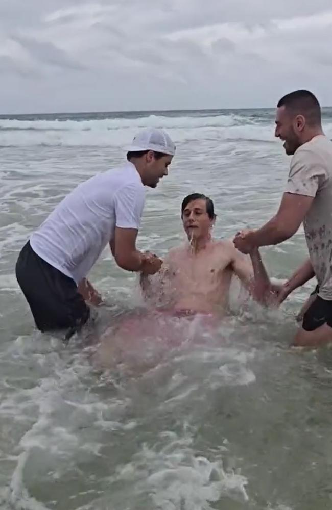 A teen being baptised at the beach. Picture: TikTok/Pat Steele