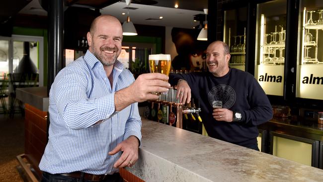 Pub owner and Crows great Mark Ricciuto and Simon Hywood, part-owner and general manager at the Alma Hotel in Norwood. Picture: Naomi Jellicoe