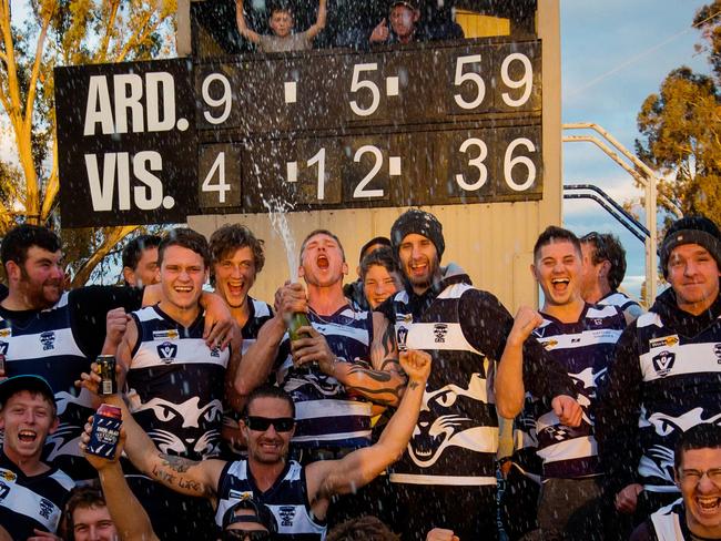 Ardmona pop the corks after ending its 29-game losing streak in 2013. Picture: Hamish Blair