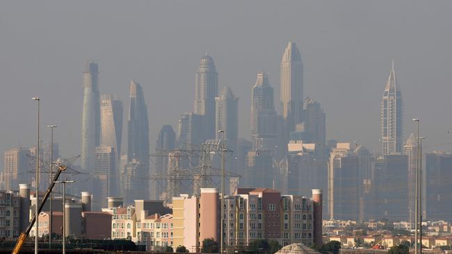 Haze obscures the Dubai skyline on December 4, 2023. The United Arab Emirates is choking under "alarmingly high" air pollution levels fed by its fossil fuel industry. Picture: Giuseppe Cacace/AFP