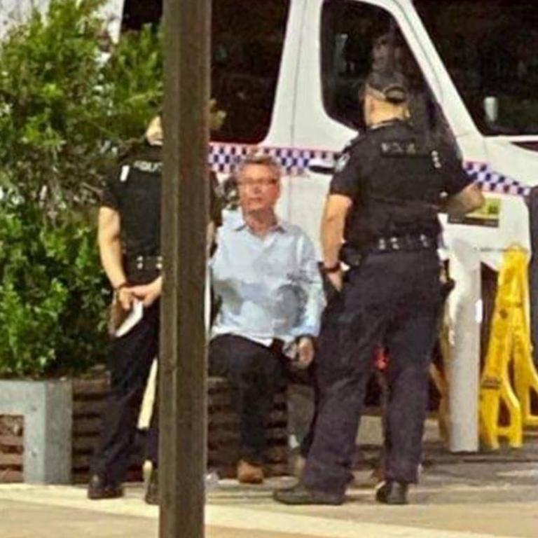 Queensland Labor MP Les Walker with police after the incident