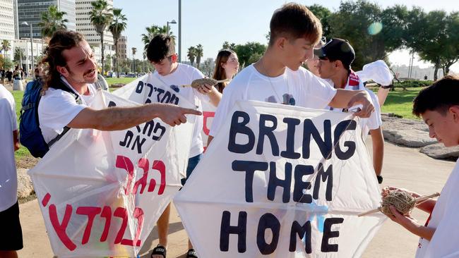 Kibbutz Kfar Azza residents and relatives of hostages abducted by Palestinian militants during the October 7 attack prepare to fly kites in memory of victims and calling for the release of their loved ones. Picture: AFP