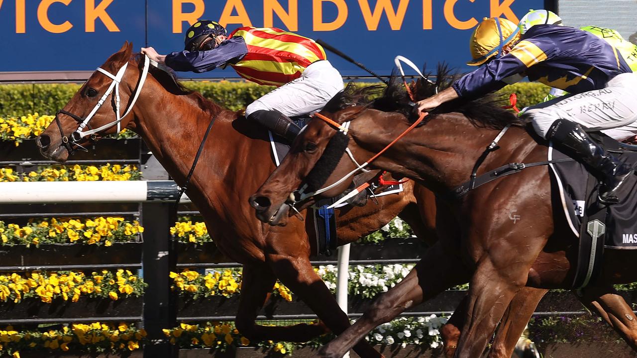 Nature Strip and James McDonald hold off their rivals to win The Everest. Picture: AFP