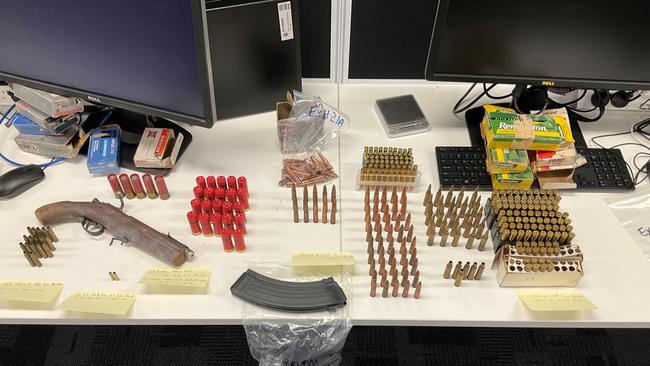 Police seized an arsenal of weapons and ammunition following a raid on a Highfields property on January 19, 2023.