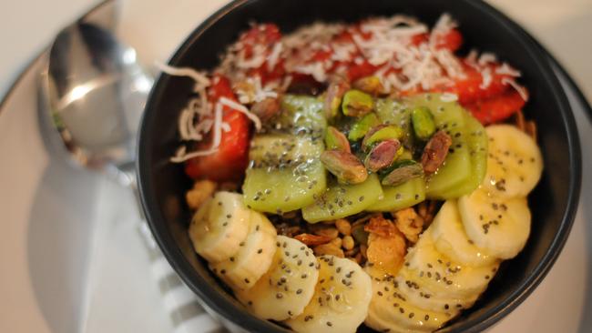 The Breaky Bowl has yoghurt topped with addictively good granola, fruit, chia seeds, pistachio and honey ($12).