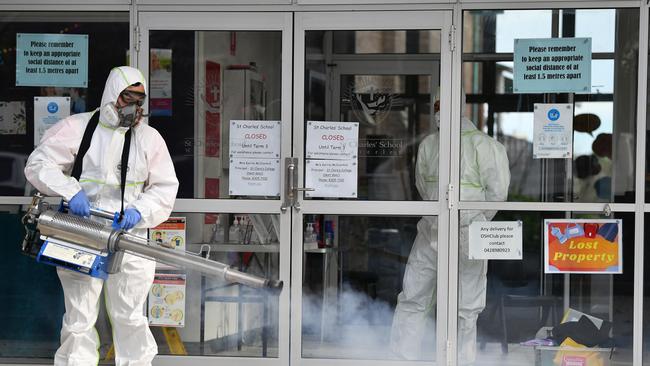 Deep cleaners commence work at St Charles Catholic Primary School at Waverley in Sydney after a confirmed case of Covid-19. Picture: Joel Carrett