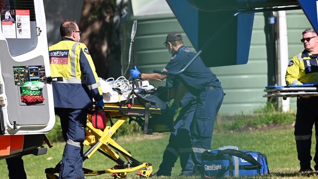 Paramedics and a CareFlight doctor treat a 9-year-old boy who had an accident at Mona Vale Public School. Picture: Seb Dekker.
