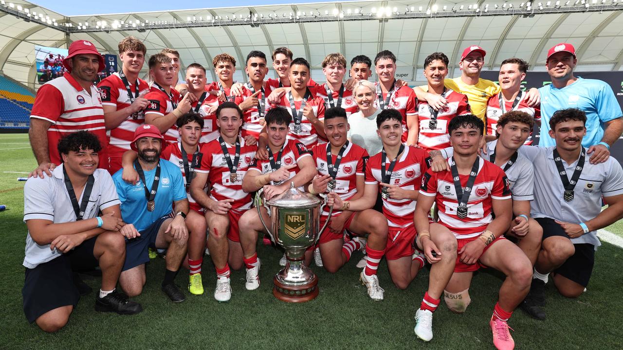 NRL National Schoolboys Cup final at CBUS Stadium between Palm Beach Currumbin and Patrician Blacktown Brothers. The Red Army and Palm Beach Currumbin players celebrate the win. .Picture Glenn Hampson