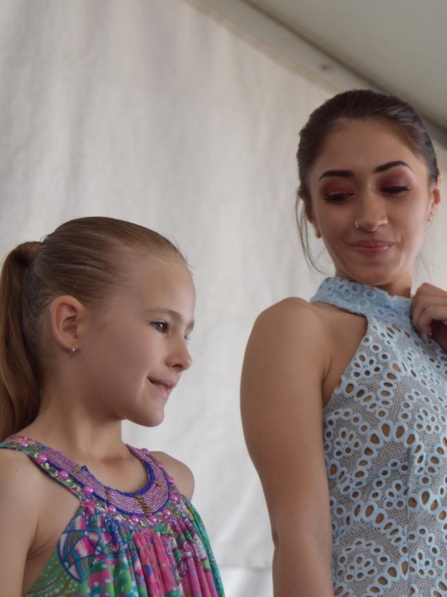 Mercury Mowen and a young model strut their stuff in fashion from Can I Wear That and Willow & Ivy at the 2016 Capricorn Food and Wine Festival.