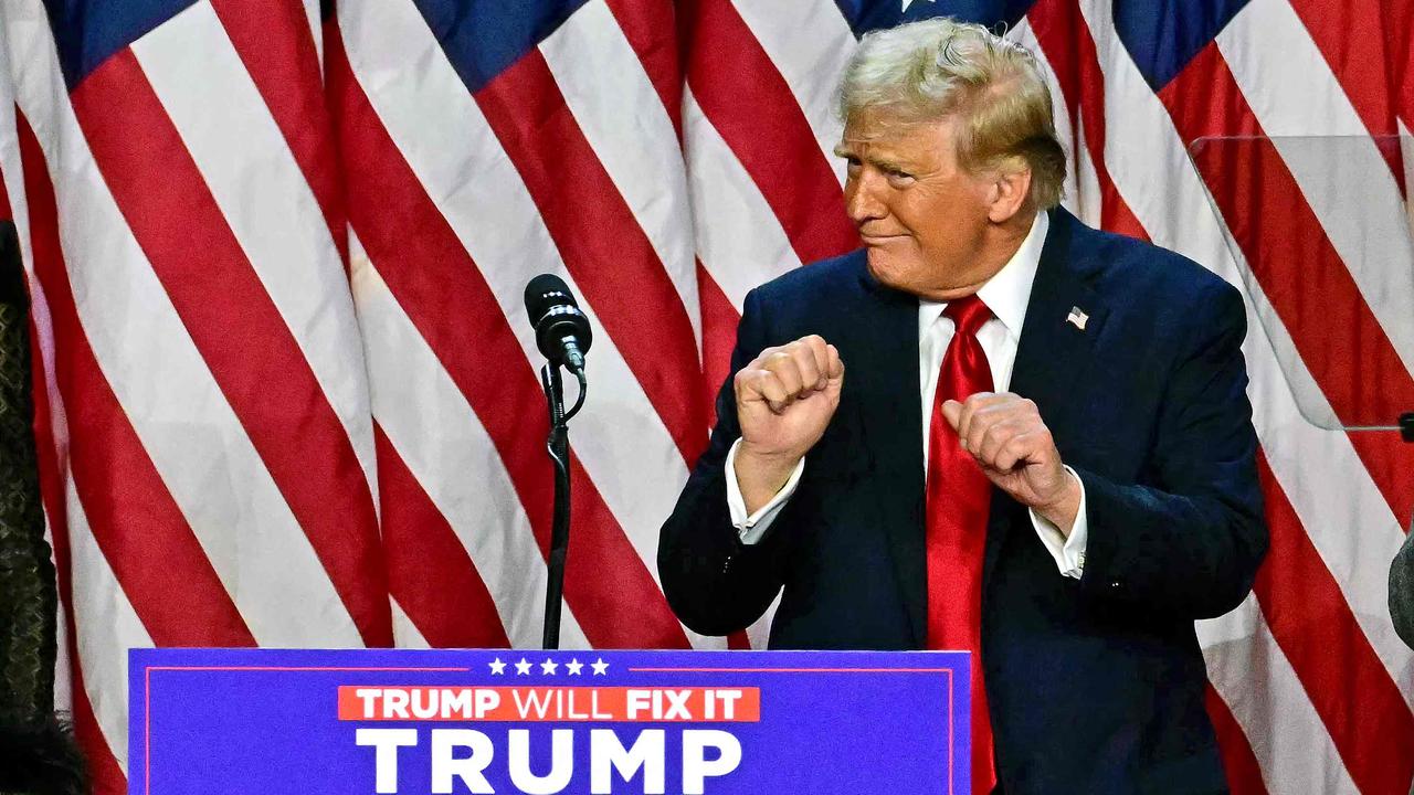 TOPSHOT - Former US President and Republican presidential candidate Donald Trump dances after speaking during an election night event at the West Palm Beach Convention Center in West Palm Beach, Florida, early on November 6, 2024. Republican former president Donald Trump closed in on a new term in the White House early November 6, 2024, just needing a handful of electoral votes to defeat Democratic Vice President Kamala Harris. (Photo by Jim WATSON / AFP)