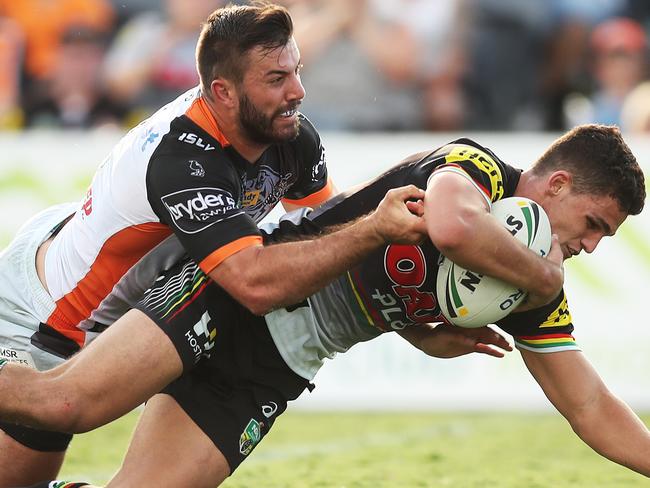 Panthers Nathan Cleary scores ahead of Wests Tigers James Tedesco. Picture. Phil Hillyard