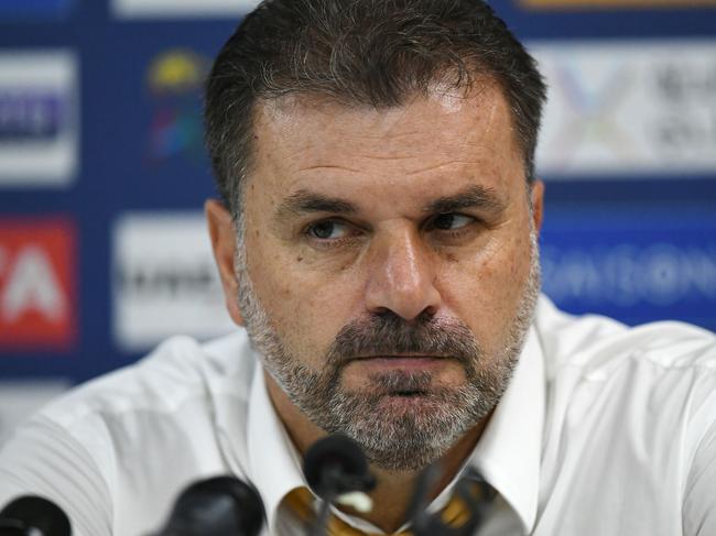 Australia's football coach Ange Postecoglou listens questions from journalists during a press conference after the 2018 World Cup qualifying football match between Syria and Australia at the Hang Jebat Stadium in Malacca on October 5, 2017. / AFP PHOTO / MOHD RASFAN