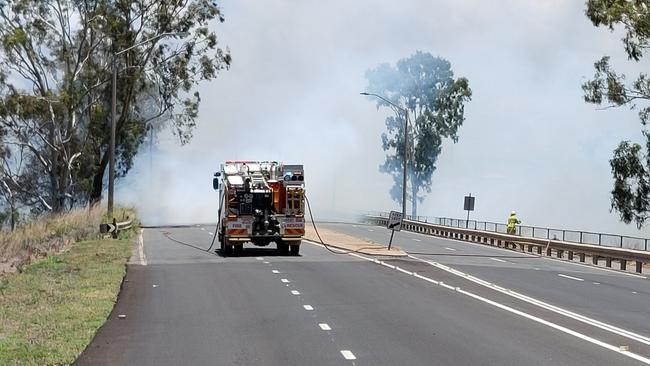 A fire that jumped Gladstone Benaraby Road at Glen Eden has shut the road to traffic. Picture: Rodney Stevens