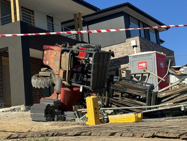 A man was taken to hospital after a forklift flipped at a building site in Mt Duneed. Photo: Alison Wynd.