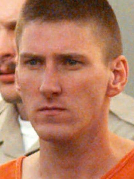 Timothy McVeigh is escorted to a waiting van from the Noble County Courthouse in Perry, Oklahoma by FBI agents and local police.