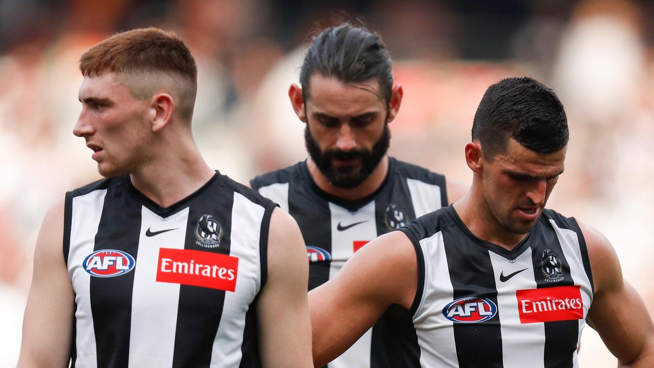 Mark Keane, left, with Collingwood teammates Brodie Grundy and Scott Pendlebury in 2021. Picture: Michael Willson/AFL Photos