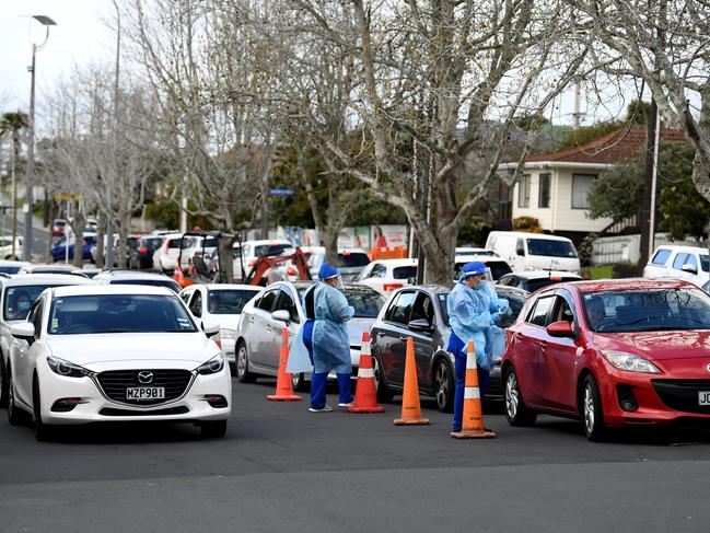 People wait in long queues to get a COVID-19 test at the Northcote COVID-19 testing facility in Auckland, New Zealand. Picture: Getty