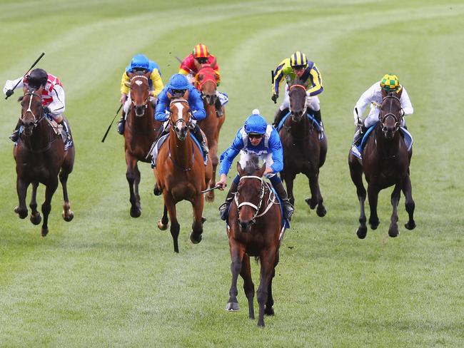 Hugh Bowman and Winx create history by recording the greatest winning margin in a Cox Plate. Picture: Getty Images