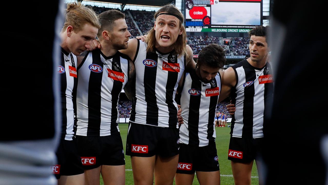 MELBOURNE, AUSTRALIA - JUNE 13: Darcy Moore of the Magpies addresses his teammates during the 2022 AFL Round 13 match between the Collingwood Magpies and the Melbourne Demons at the Melbourne Cricket Ground on June 13, 2022 in Melbourne, Australia. (Photo by Dylan Burns/AFL Photos via Getty Images)
