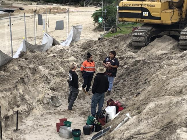 Officials from the Aboriginal Heritage Office and Metropolitan Local Aboriginal Land Council at a construction site at Little Manly Beach a day after Northern Beaches Council contractors, building a new seawall, uncovered historic human bones in July, 2022. Picture: Jim O'Rourke