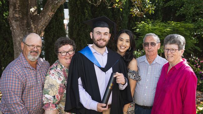 Bachelor of Science graduate Will Fisher celebrates with (from left) Greg Fisher, Alison Fisher, Evangeline Hamilton, Steve Mizen and Sue Mizen at a UniSQ graduation ceremony at The Empire, Tuesday, October 29, 2024. Picture: Kevin Farmer