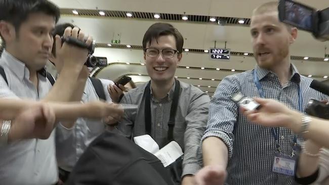 Australian student Alek Sigley arrives at Beijing’s airport yesterday after being rescued from North Korea. Picture: AP