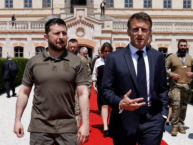 French President Emmanuel Macron (R) and Ukraine President Volodymyr Zelenskyy walk after meeting during the European Political Community Summit. Picture: AFP