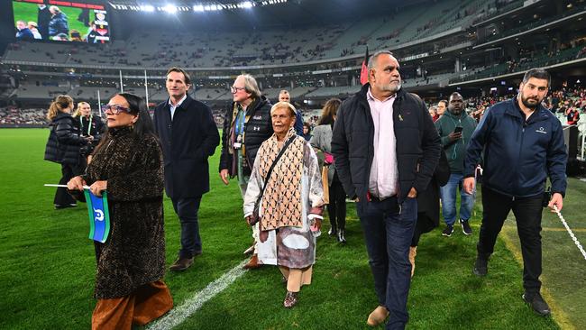 MELBOURNE, AUSTRALIA – MAY 25: Michael Long leads the Long Walk ahead of the round 11 AFL match between Richmond Tigers and Essendon Bombers at Melbourne Cricket Ground, on May 25, 2024, in Melbourne, Australia. (Photo by Morgan Hancock/AFL Photos/via Getty Images)