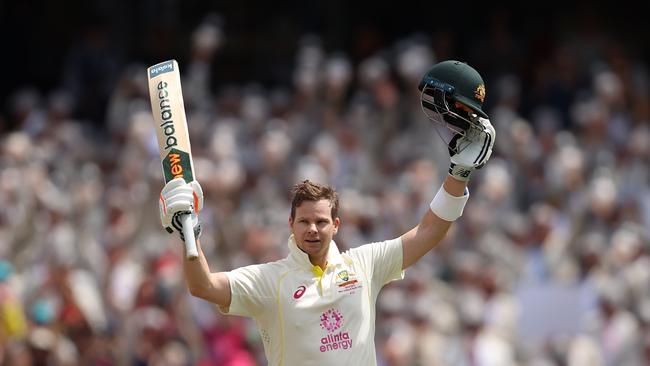 Steve Smith raises his arms in celebration after notching his 30th Test century. Picture: Getty