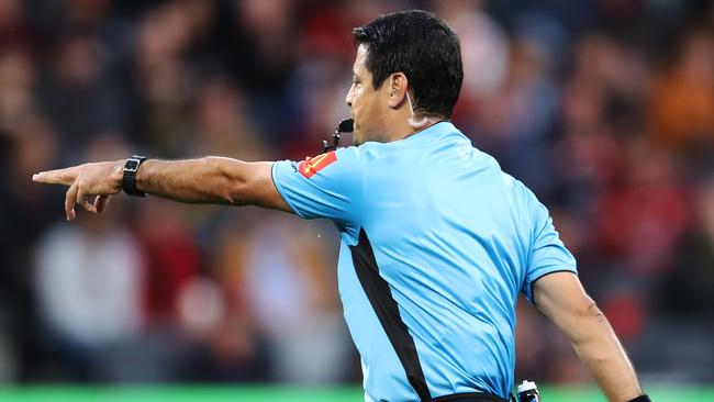 Referee Alireza Faghani points to the penalty spot after reviewing a handball with VAR during the round one A-League match between the Western Sydney and the Central Coast.