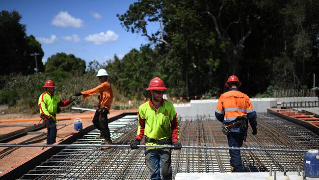 Construction workers at the Haughton River Bridge construction site on the Bruce Highway, south of Townsville. Queensland Premier Annastacia Palaszczuk visited the site while on the election campaign trail. Picture: NCA NewsWire / Dan Peled