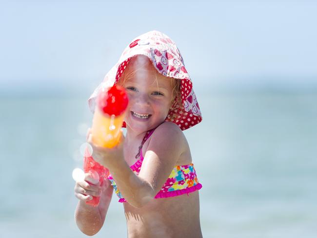 Ruby Mitchell 6, has fun with a water pistol at Blairgowrie on December 31, 2014. Picture: Eugene Hyland