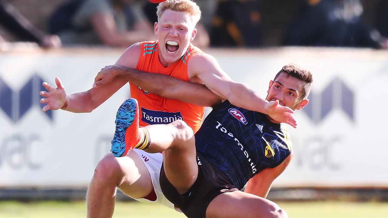 Darren Minchington battles James Sicily in a contest at Hawthorn training.