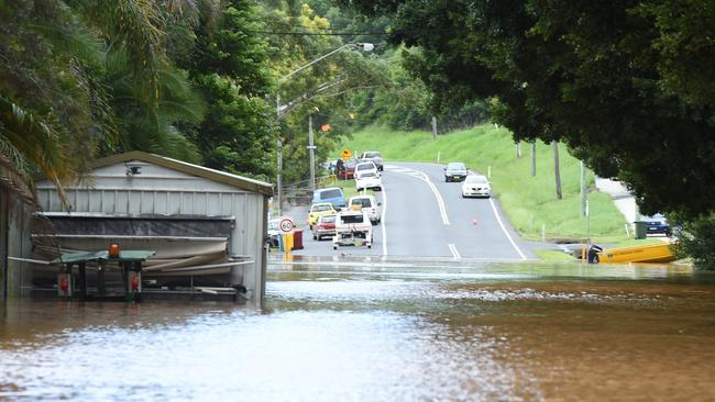 Water flows along Brunswick St in Lismore, which goes past Trinity Catholic College.