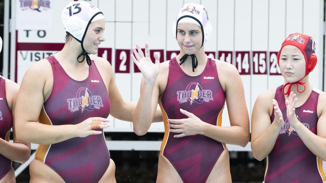 Tenealle Fasala, No.13, with Thunder team mates Alice Campbell and Ayumi Watanabe this year.(AAP Image/Richard Walker)