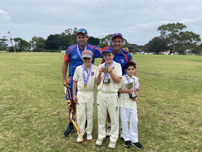 Premiers: Dwayne Field (back left) and Shane Beggs with (in front, left to right) Sam Field, Charlie Beggs and Ethan Beggs after Flinders won the U12 flag.