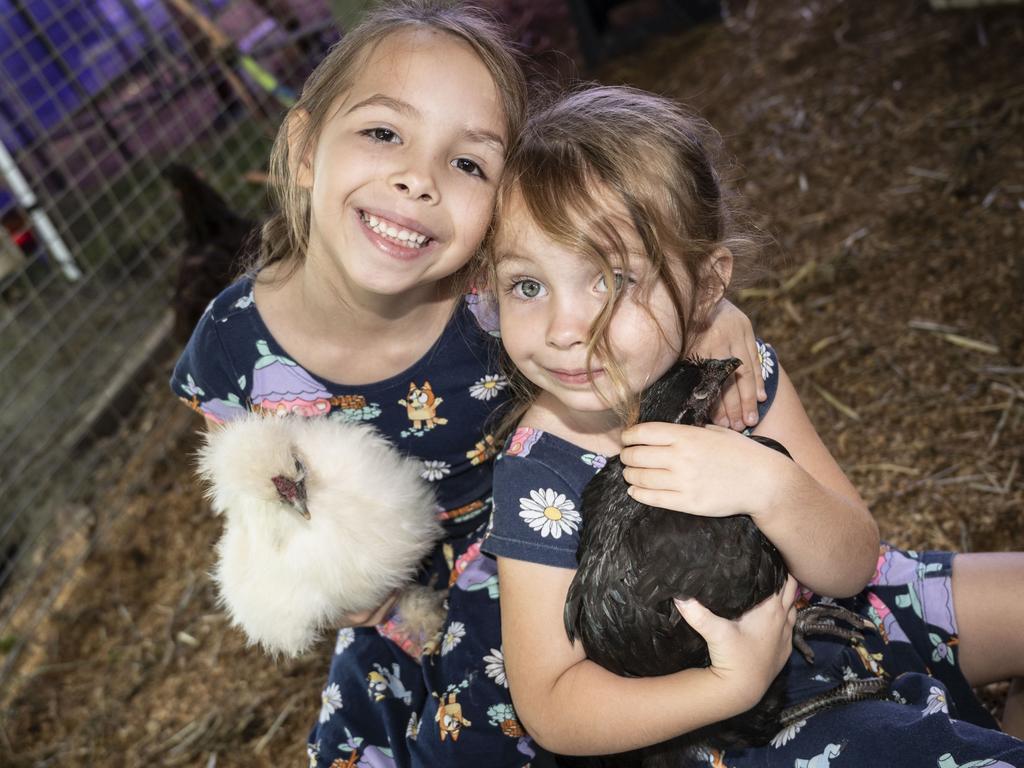 Amelia and Lexi Gesch enjoy Viv's Farm Animals at the Toowoomba Royal Show. Friday, March 25, 2022. Picture: Nev Madsen.