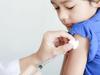 Boy and vaccine syringe  vaccinations generic