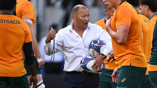 Australia's head coach Eddie Jones leads warm up prior to the  France 2023 Rugby World Cup Pool C match between Australia and Portugal at Stade Geoffroy-Guichard in Saint-Etienne, south-eastern France, on October 1, 2023. (Photo by SEBASTIEN BOZON / AFP)