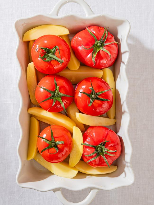 Ready to go into the oven. Stuffed tomatoes and potatoes. Photos: Nikki To / TWAM