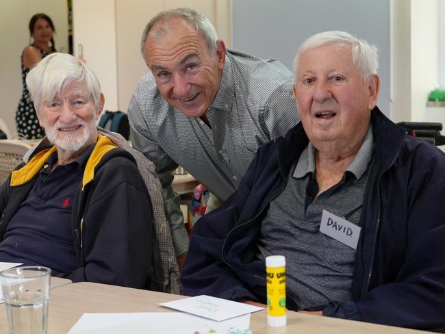 Bill Yeates (centre) with Manly Beachcomber Social Club members Frank Pearce (left) and David Keating (right). Picture: HammondCare