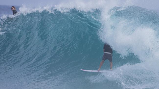 Surfers enjoying the larger swell at Snapper Rocks on Sunday 2 January 2022. Picture: Jerad Williams