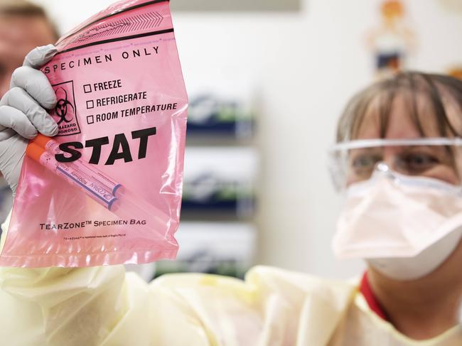 Janice Geary (clinical nurse consultant, Infection Management Service) demonstrating patient check for Covid-19 coronavirus. Fever Clinic at The Prince Charles Hospital, Rode Rd, Chermside, Brisbane, 6th of March 2020. (AAP Image/Attila Csaszar)