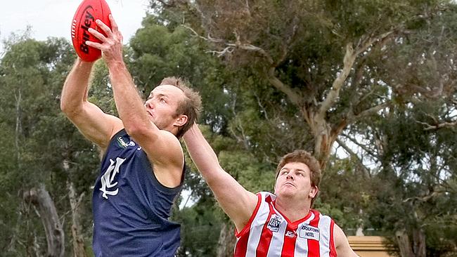 Lucindale's important utility player Nigel Fiegert marks strongly in front of Bordertown's Brad Warncken. Picture: Peter Chatfield