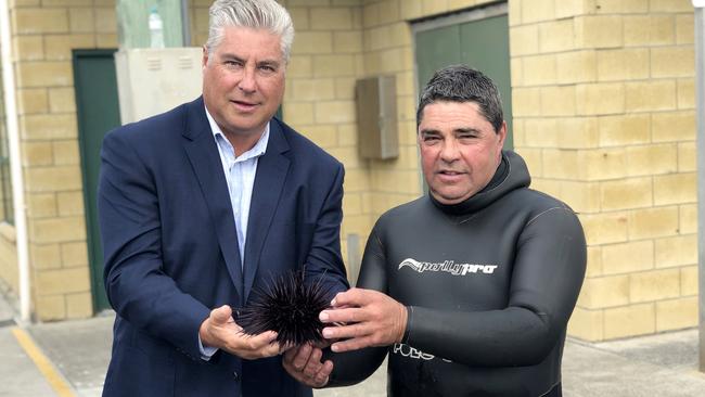 Tasmanian Abalone Council chief executive Dean Lisson and diver Barry Bennett with a long-spined sea urchin. Picture: SUPPLIED