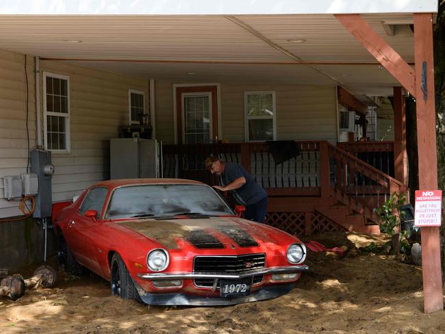 Old Fort resident Tommy Taylor looks inside at his 1972 Chevy Camaro for the first time in the aftermath of Hurricane Helene. Picture: Getty Images via AFP