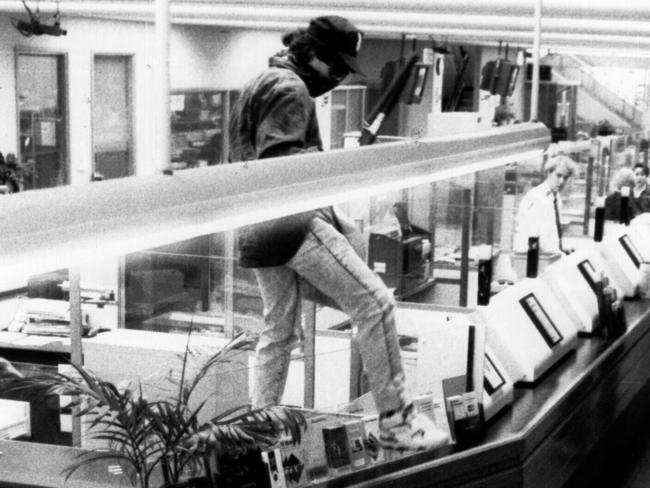 Surveillance tape of robber Christopher Binse aka ‘Badness’ mounting counter during 1992 armed holdup at Chatswood's Commonwealth Bank.