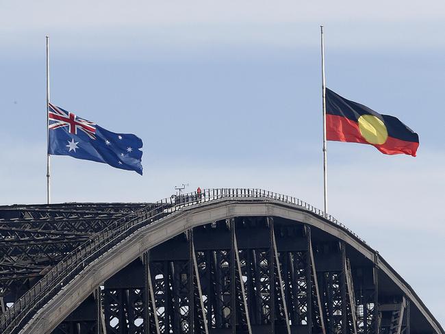 SYDNEY, AUSTRALIA - NewsWire Photos APRIL 15, 2024. Flags fly at half mast on the Sydney Harbour Bridge in Sydney after the multiple stabbing at Bondi Junction over the weekend. Picture: NCA NewsWire / John Appleyard